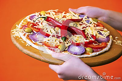 Funny boy chef cooked pizza on a board Stock Photo