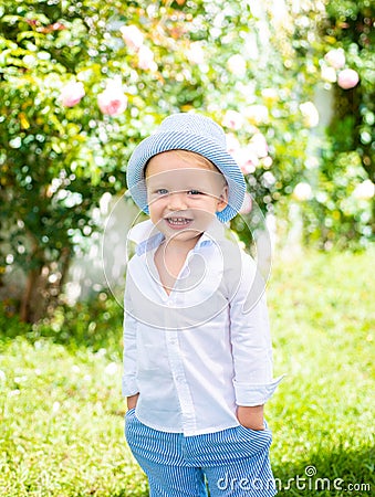 Funny boy. Little child have fun on fresh air. Happy childhood. Little child enjoy walk. Stock Photo