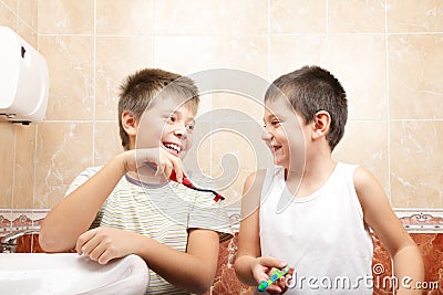 Funny boys with toothbrushes Stock Photo