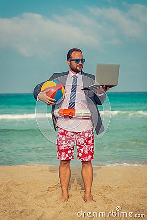 Funny businessman on the beach Stock Photo