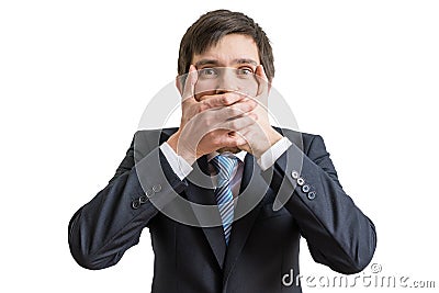 Funny businessman is covering his mouth with hands. Isolated on white background Stock Photo