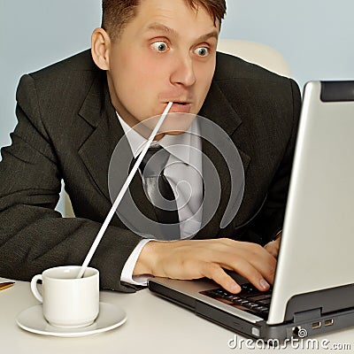 Funny businessman drinking coffee and working Stock Photo