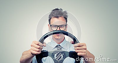 Funny businessman in glasses with a steering wheel Stock Photo