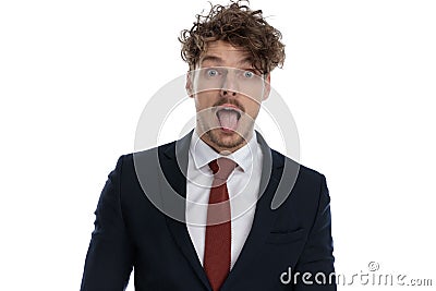 Funny businessman sticking out his tongue and making silly face Stock Photo