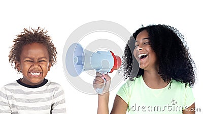 Funny childr shouting through a megaphone to his brother Stock Photo
