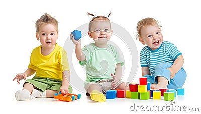 Funny children group playing colorful toys isolated on white Stock Photo