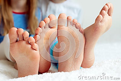 Funny children's foots is barefoot, closeup. Stock Photo