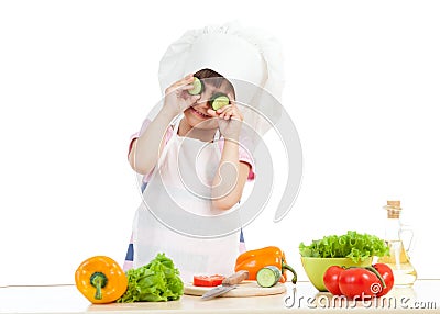 Funny cook child girl cooking at kitchen Stock Photo