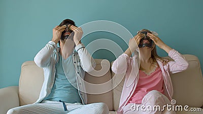 Funny couple in black facial masks Stock Photo