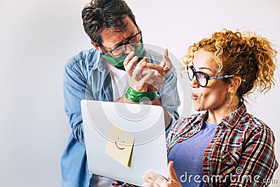 Funny couple in black friday or cyber monday sale day at home - wife woman with laptop computer and angry man - shopping online Stock Photo