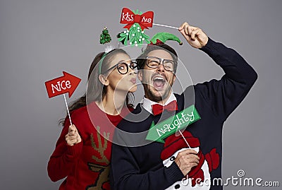 Funny couple in love with photo booth gadgets Stock Photo