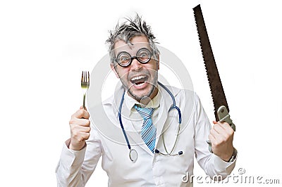 Funny and crazy doctor is laughing and holds saw in hand on whit Stock Photo