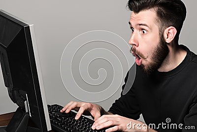 Funny and crazy man using a computer Stock Photo