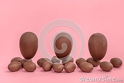 Funny creative concept of flying Easter eggs on pink background Stock Photo