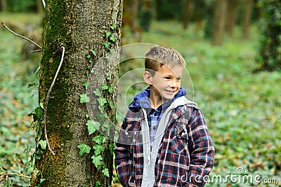 Funny and cute. Funny kid. Small kid play in woods. Small boy have fun outdoor. Being funny I can make girls smile Stock Photo