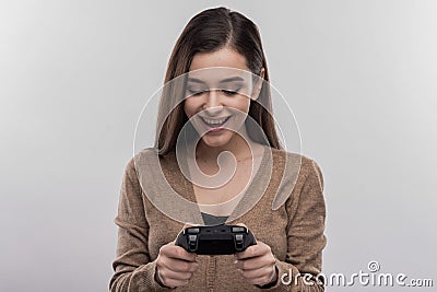 Funny cute woman holing joystick playing new video game Stock Photo