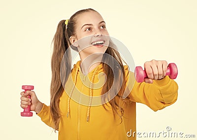 so funny. determination. happy teen girl with dumbbell. sport and fitness. Stock Photo