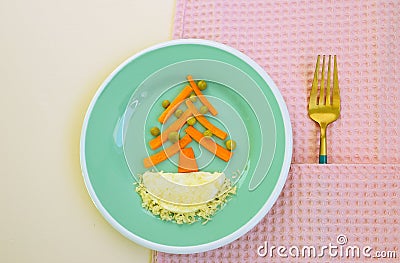 Funny dish for Kids made of eggs and carrot. Food art. Restaurant menu. Creative dish. Breakfast for children. Snack time Stock Photo