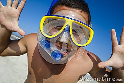 Funny diving man in a swimming mask and snorkel Stock Photo