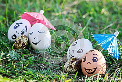 Funny eggs imitating two couples with versicolored babies Stock Photo