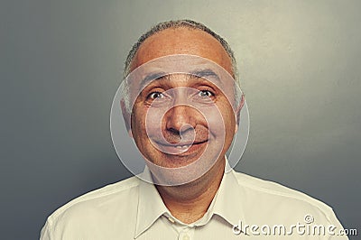 Funny excited man over dark Stock Photo