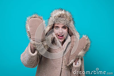 Funny excited Woman in winter warm hat and Winter gloves. Fun girl in woolen coat. Girl in winters cloth. Young woman in Stock Photo