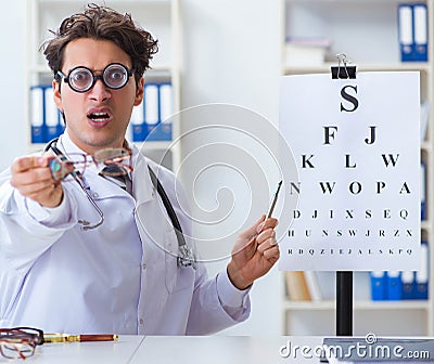 Funny eye doctor in humourous medical concept Stock Photo