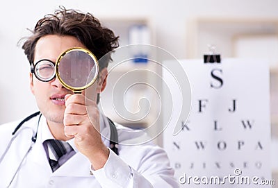 Funny eye doctor in humourous medical concept Stock Photo