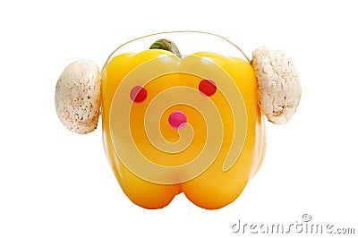 Funny face with headphones from yellow paprika Stock Photo