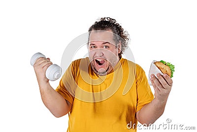 Funny fat man eating unhealthy food and trying to take exercise isolated on white background Stock Photo