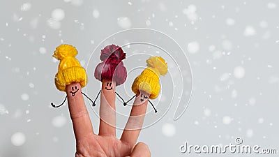 Funny fingers with a face in a winter hat Stock Photo