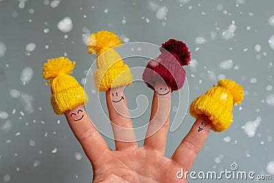 Funny fingers with a face in a winter hat Stock Photo