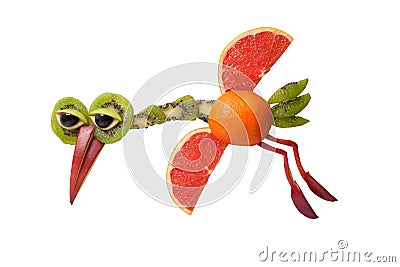 Funny flying bird made of grapefruit and kiwi Stock Photo