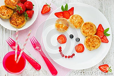 Funny food art idea for healthy baby girl breakfast - cheese pan Stock Photo
