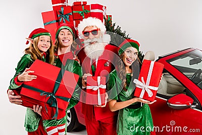 Funny four people costume theme x-mas party preparation concept hold presents isolated white color background Stock Photo
