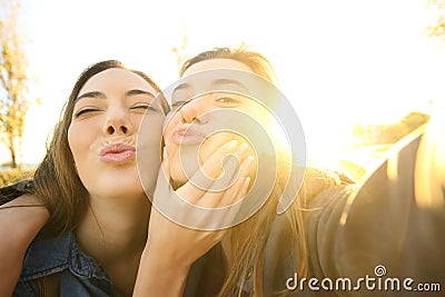 Funny friends taking a selfie at sunset Stock Photo