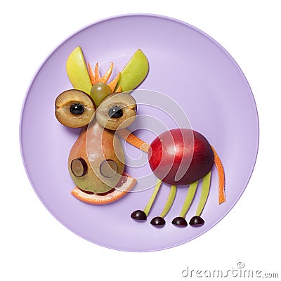 Funny fruit donkey compiled on purple plate Stock Photo