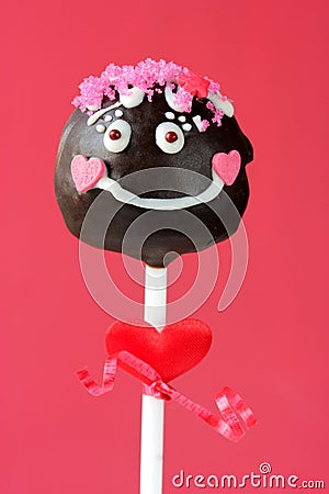 Funny girl cake pops on pink background Stock Photo
