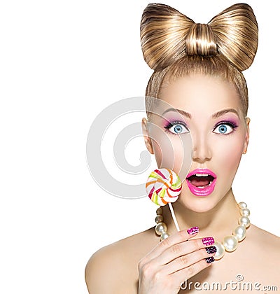 Funny girl eating lollipop Stock Photo