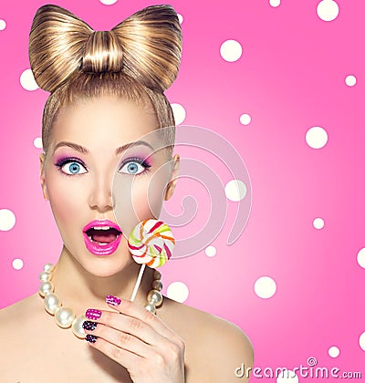 Funny girl eating lollipop Stock Photo