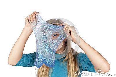 Funny girl holdin a glitter slime in front of her face Stock Photo