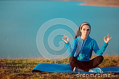 Funny Girl Meditating on Yoga Mat in Nature Stock Photo