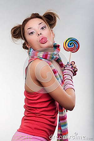 Funny girl with motley candy Stock Photo