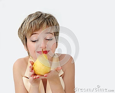 Funny girl with a pear Stock Photo