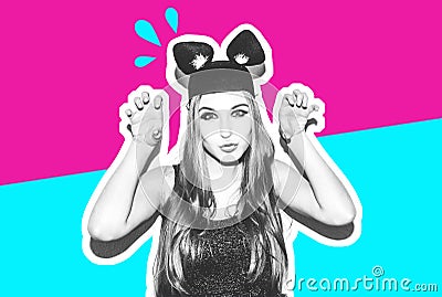 Funny girl represents a small cat or mouse. Woman with a bright makeup hairstyle and night dress mouse ears having fun Stock Photo