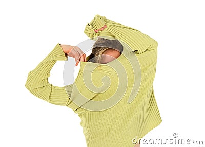Funny girl takes off a green sweater Stock Photo