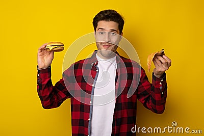 Funny Guy Holding Burger And Slice Of Pizza Stock Photo