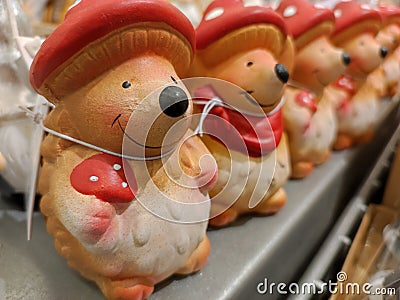 Funny hedgehogs figures with mushroom hats Stock Photo