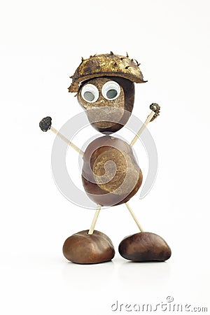 Funny human shape character or figurine made with chestnuts in w Stock Photo