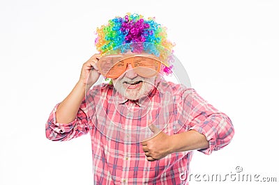 Funny idea. Crazy man in playful mood. mature bearded man in colorful wig and party glasses. anniversary holiday. happy Stock Photo